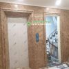 đá nâu tây ban nha ốp mặt tiền thang máy