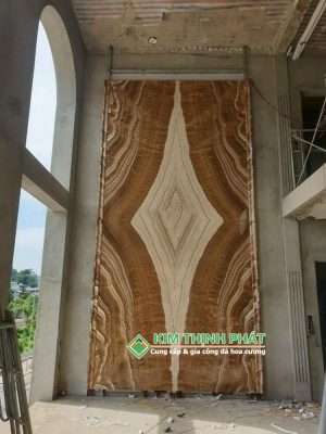 ốp tường đá vàng vân gỗ